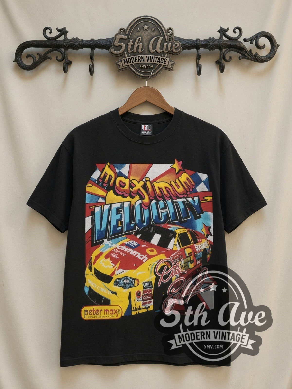 NASCAR Dale Earnhardt #3 Maximum Velocity Peter Max all-over-print vintage NASCAR t-shirt, front view on a display rack