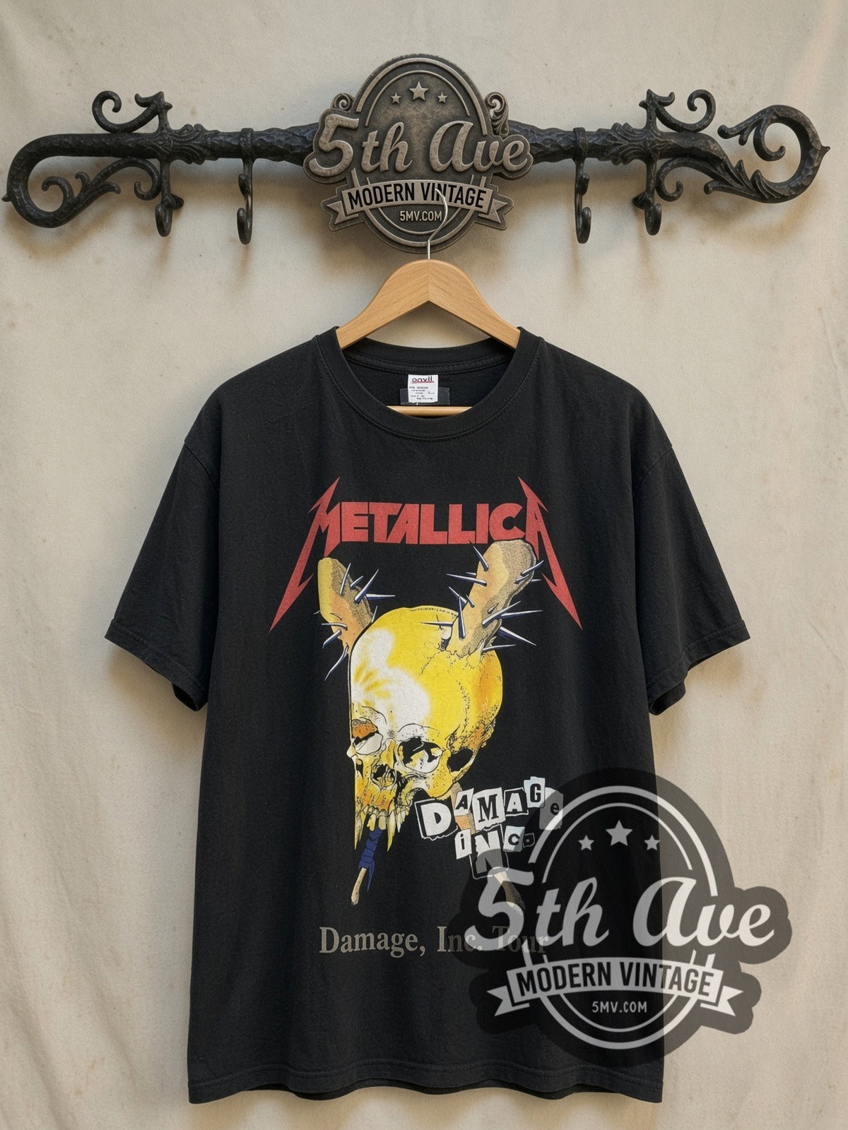 Metallica Damage, Inc. Tour vintage band t-shirt, front view on a display rack