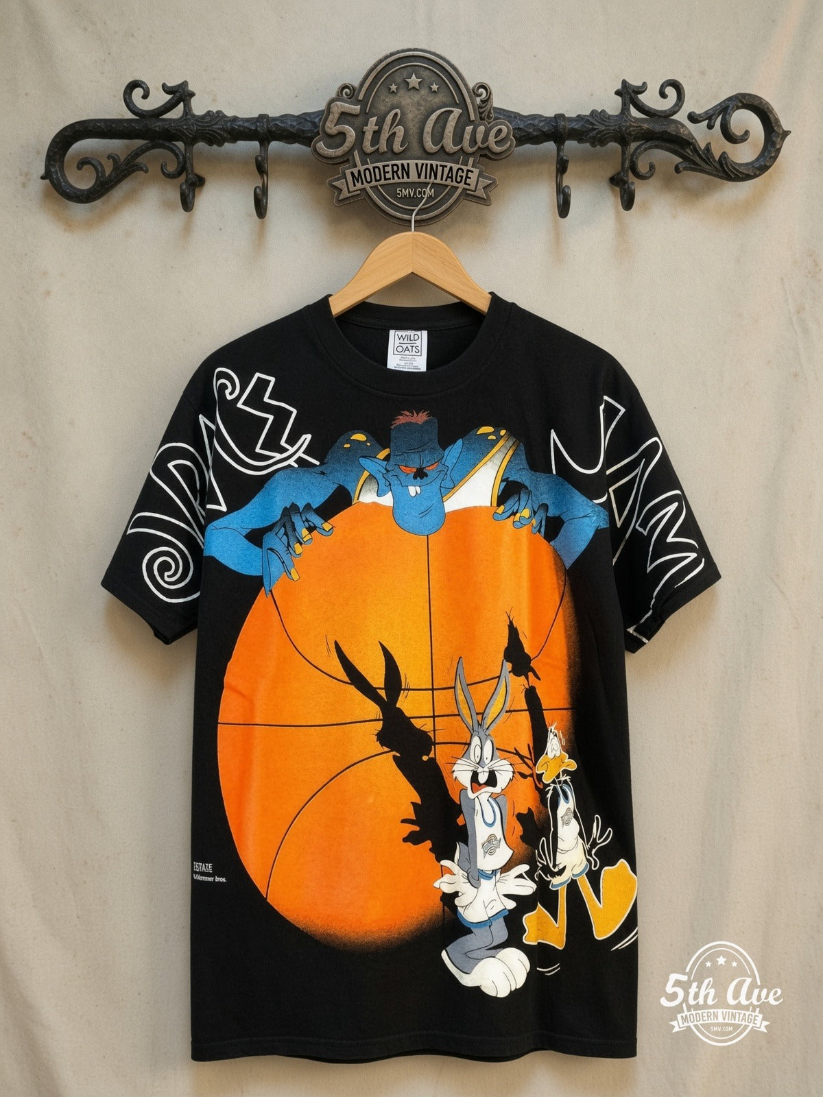Looney Tunes Space Jam Bugs Bunny and Daffy Duck all-over-print graphic tee, front view on a display rack