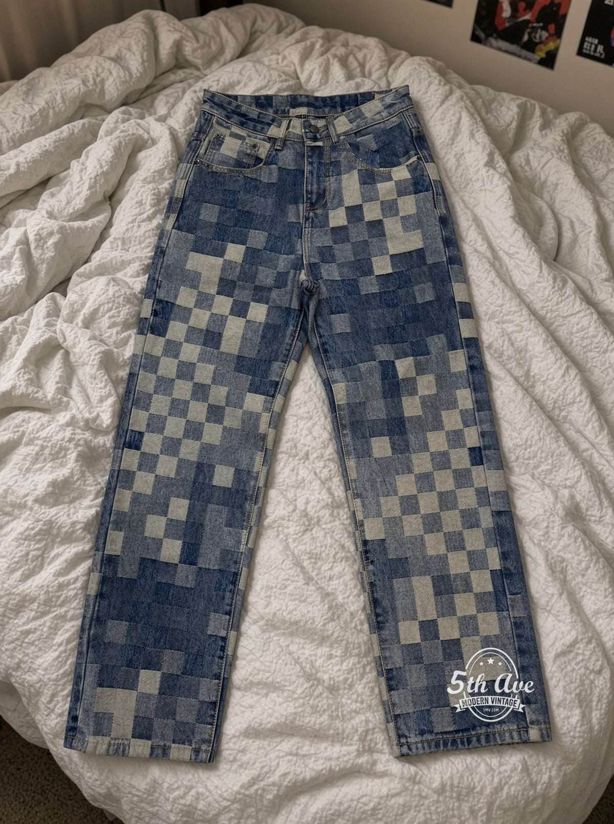Pixel Checkerboard Denim Jeans laid on bed