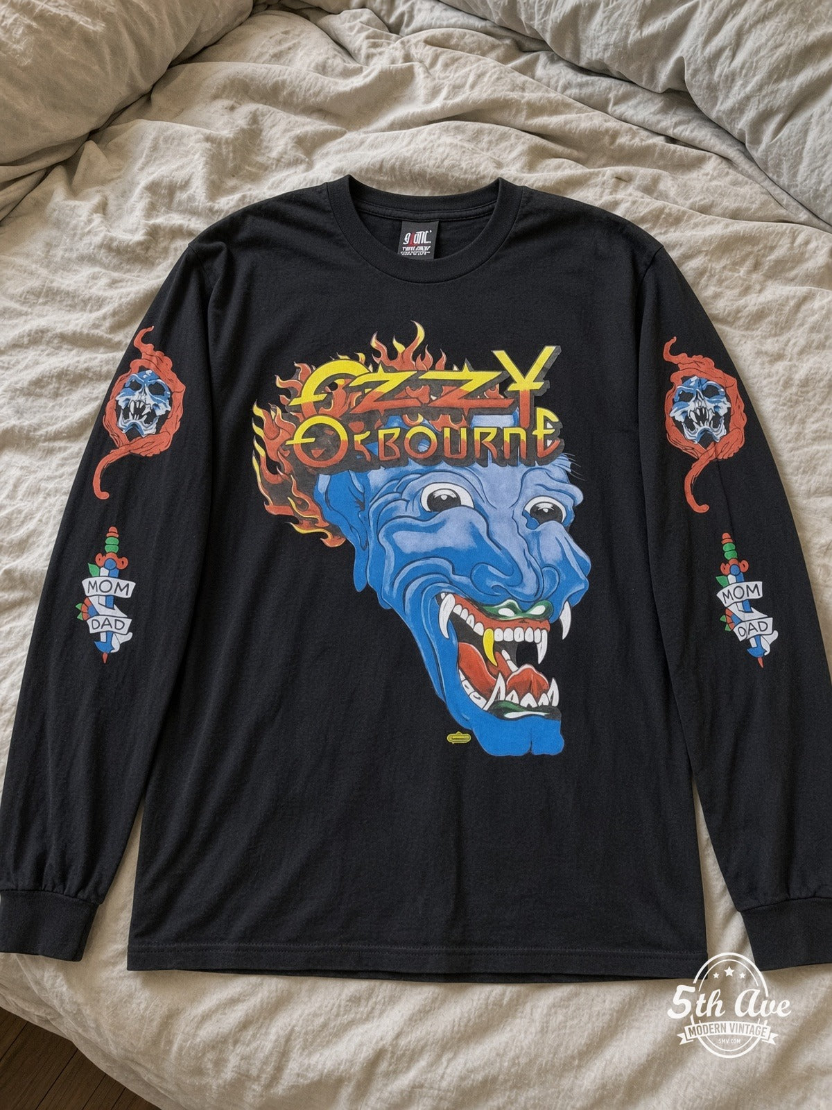 ETS LS 04 Ozzy Osbourne Flaming Blue Demon long sleeve vintage tee laid on a bed