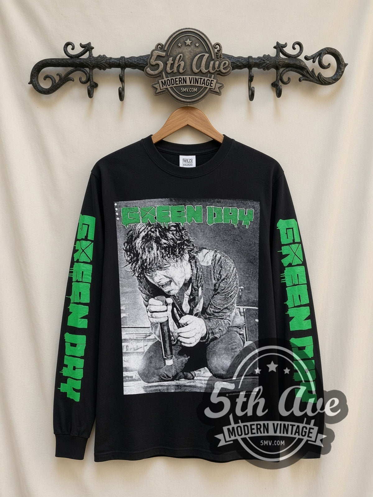 Green Day Kneeling Singer vintage band long sleeve t-shirt, front view on a display rack