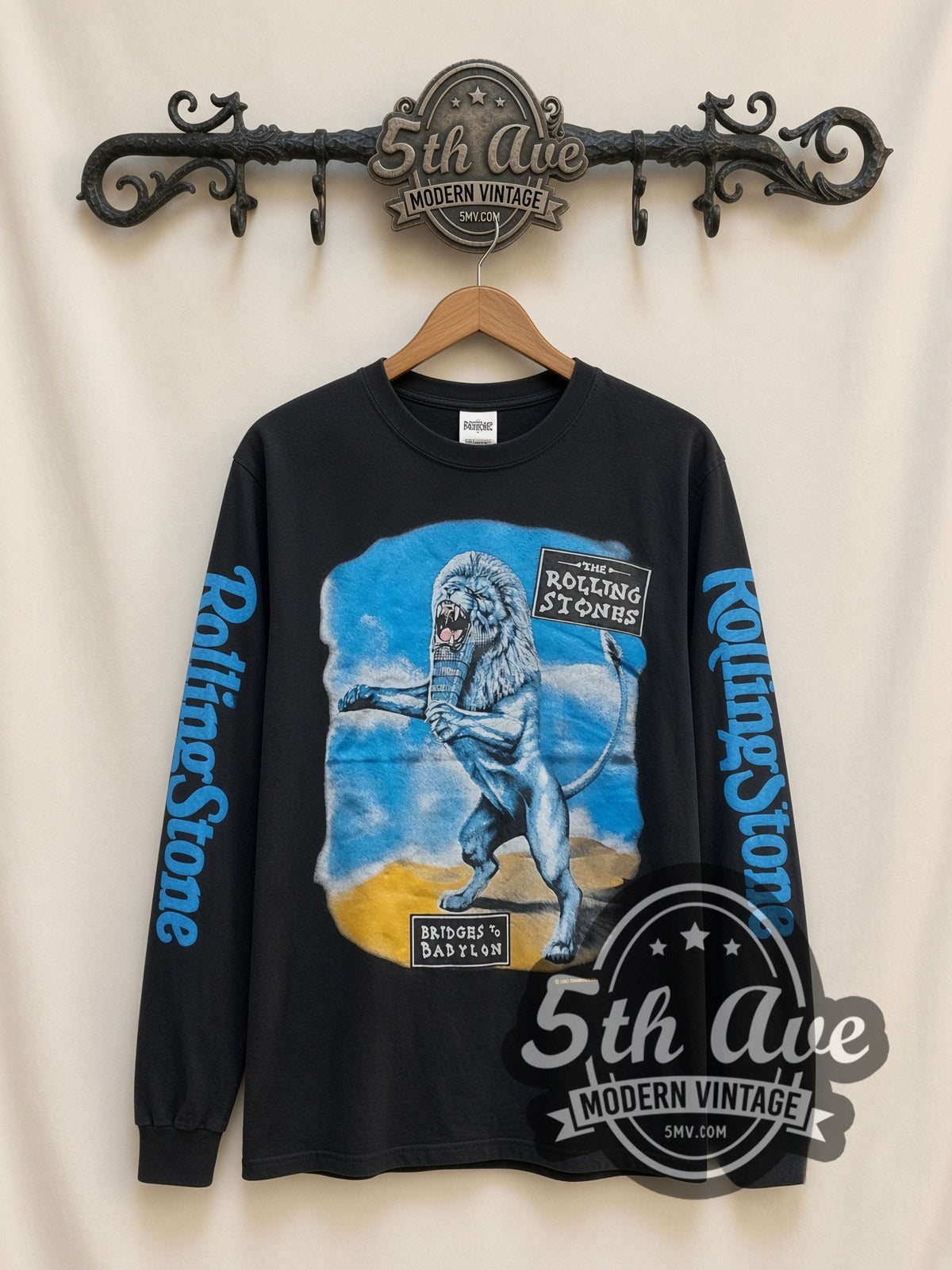 The Rolling Stones Bridges to Babylon Lion vintage band long sleeve t-shirt, front view on a display rack