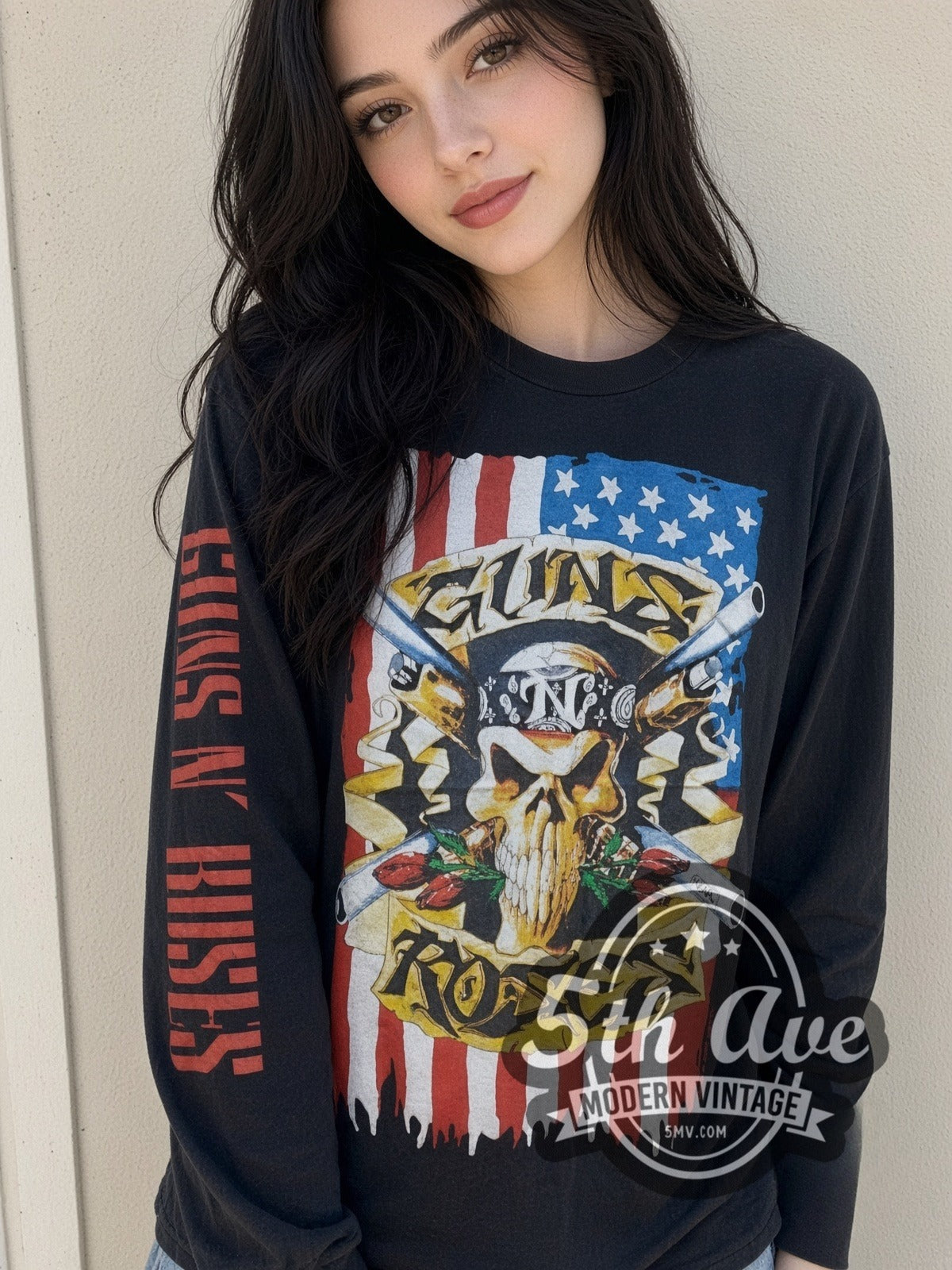 Model wearing the Guns N' Roses Skull Crossed Guns Flag vintage band long sleeve t-shirt