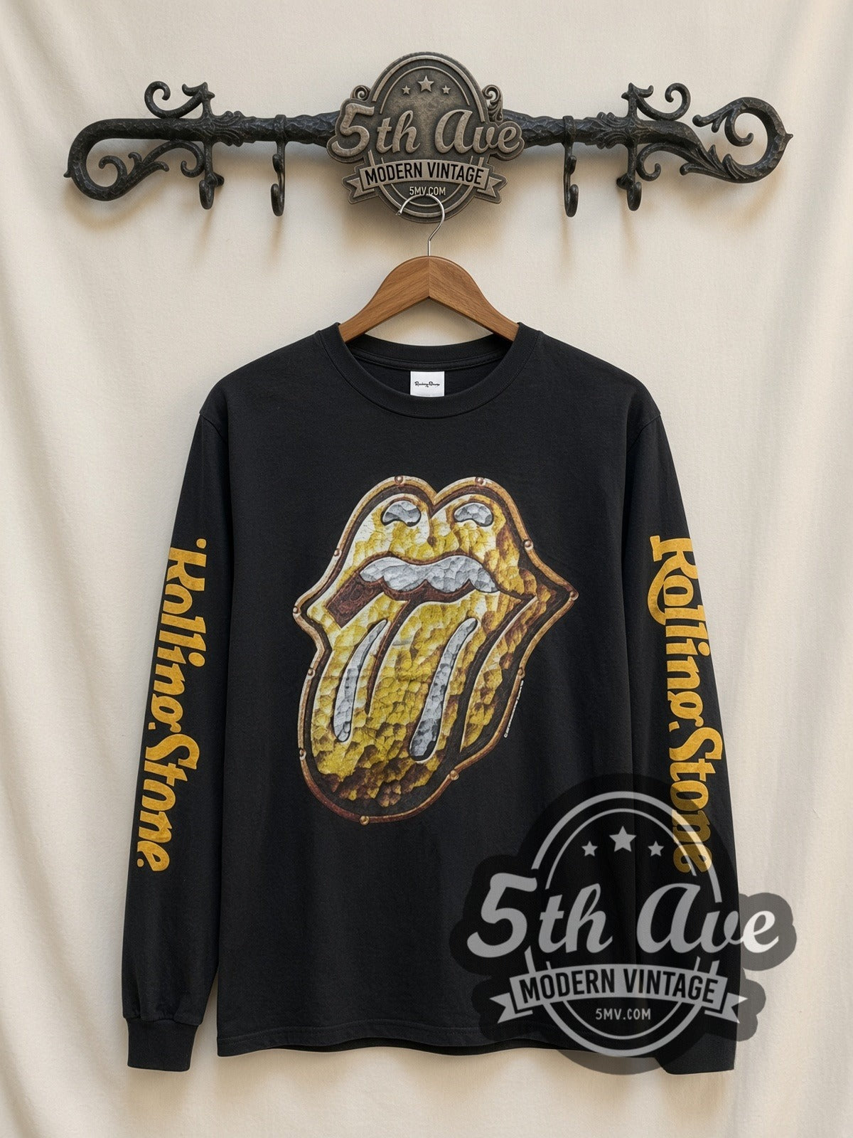 The Rolling Stones Gold Tongue vintage band long sleeve t-shirt, front view on a display rack