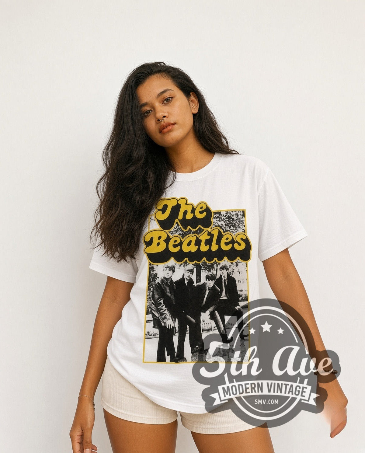 Model wearing The Beatles Cartoon Band vintage band t-shirt in white