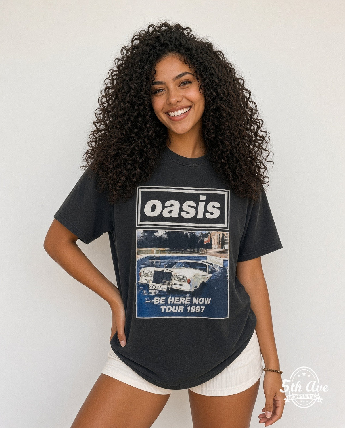 Model wearing the Oasis Be Here Now' Tour 1997 vintage band t-shirt in black