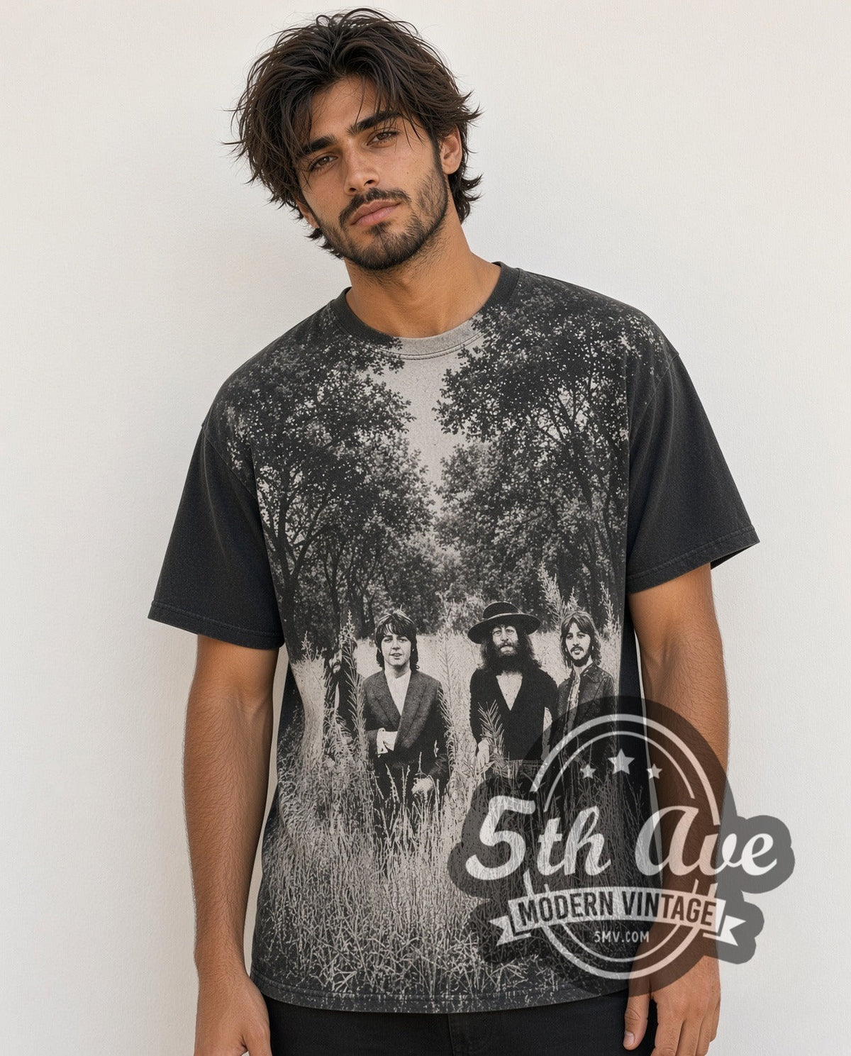 Model wearing The Beatles Field of Grass 1995 all-over-print vintage band t-shirt in black