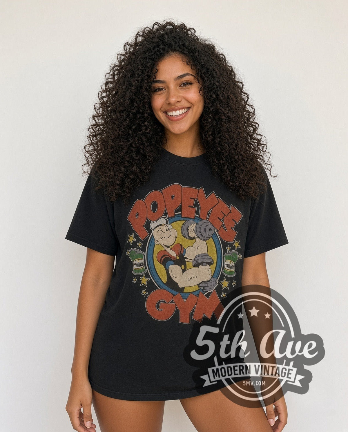 Model wearing the Popeye Spinach graphic tee
