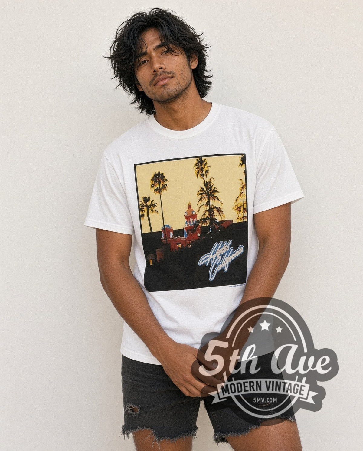 Model wearing the Eagles Hotel Sign vintage band t-shirt in white