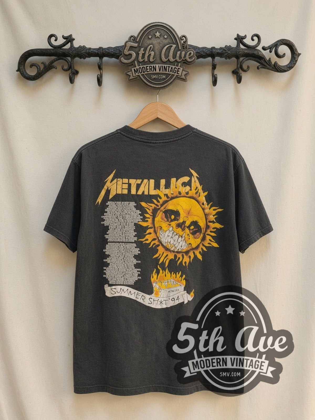 Metallica Summer Shit '94 Flaming Skull vintage band t-shirt, back view on a display rack