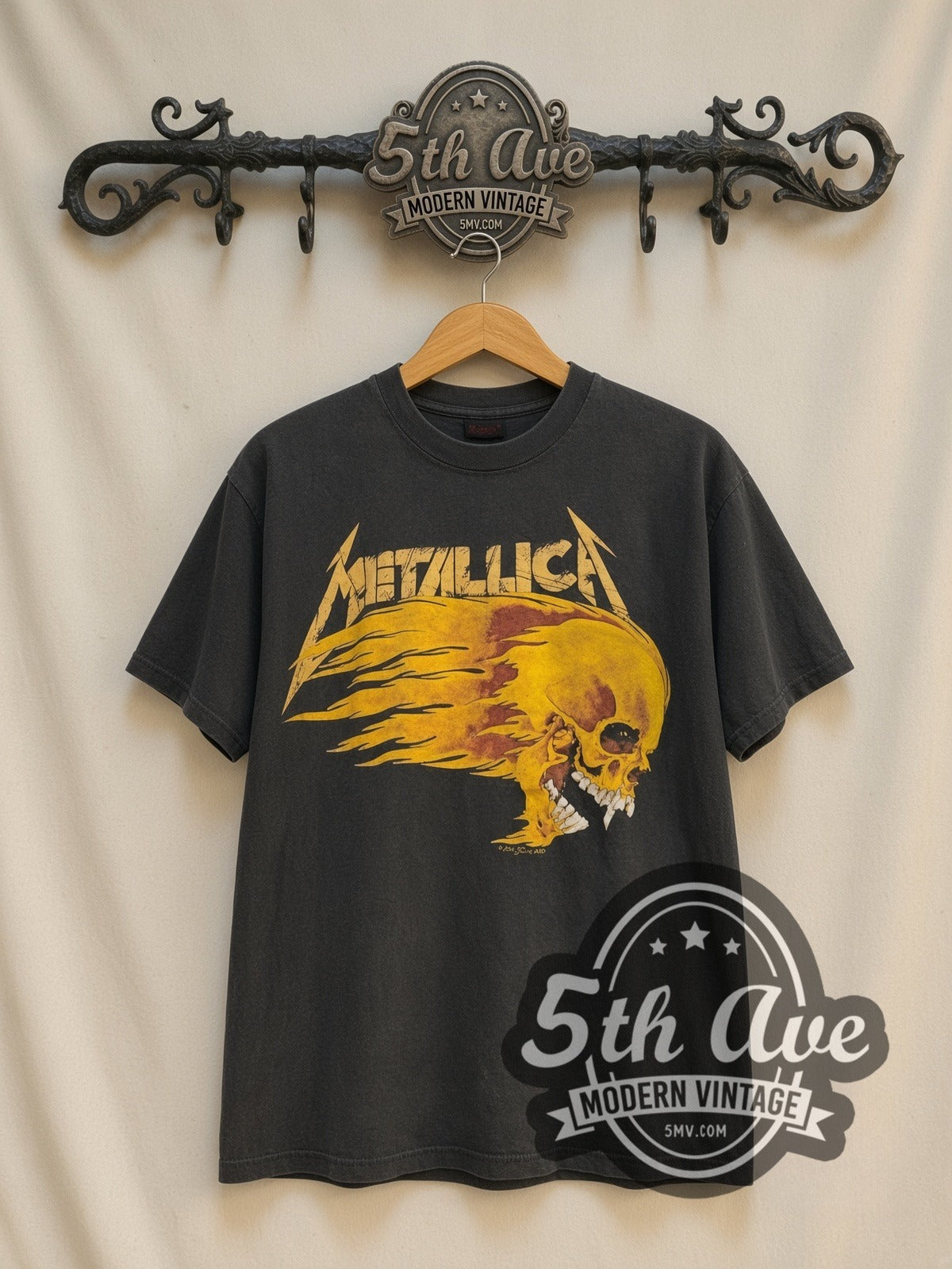 Metallica Summer Shit '94 Flaming Skull vintage band t-shirt, front view on a display rack