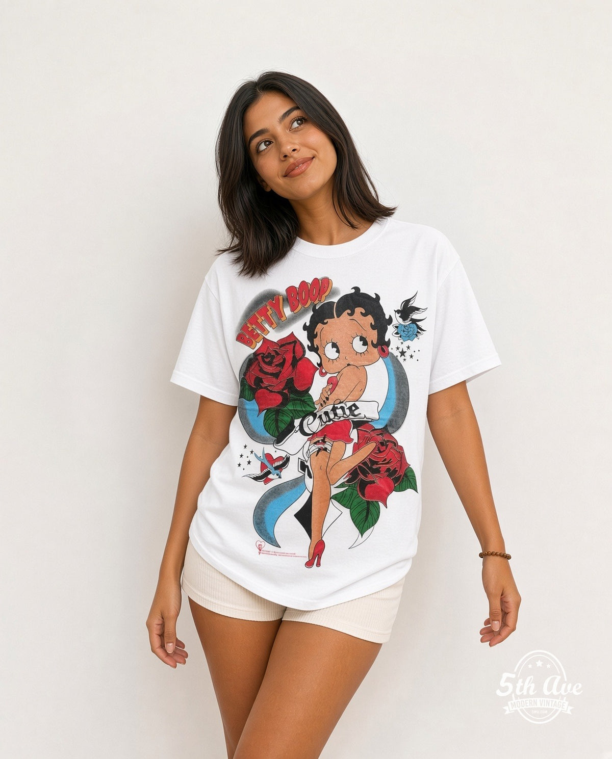 Model wearing the Betty Boop Cutie Tattoo Roses White graphic tee in white