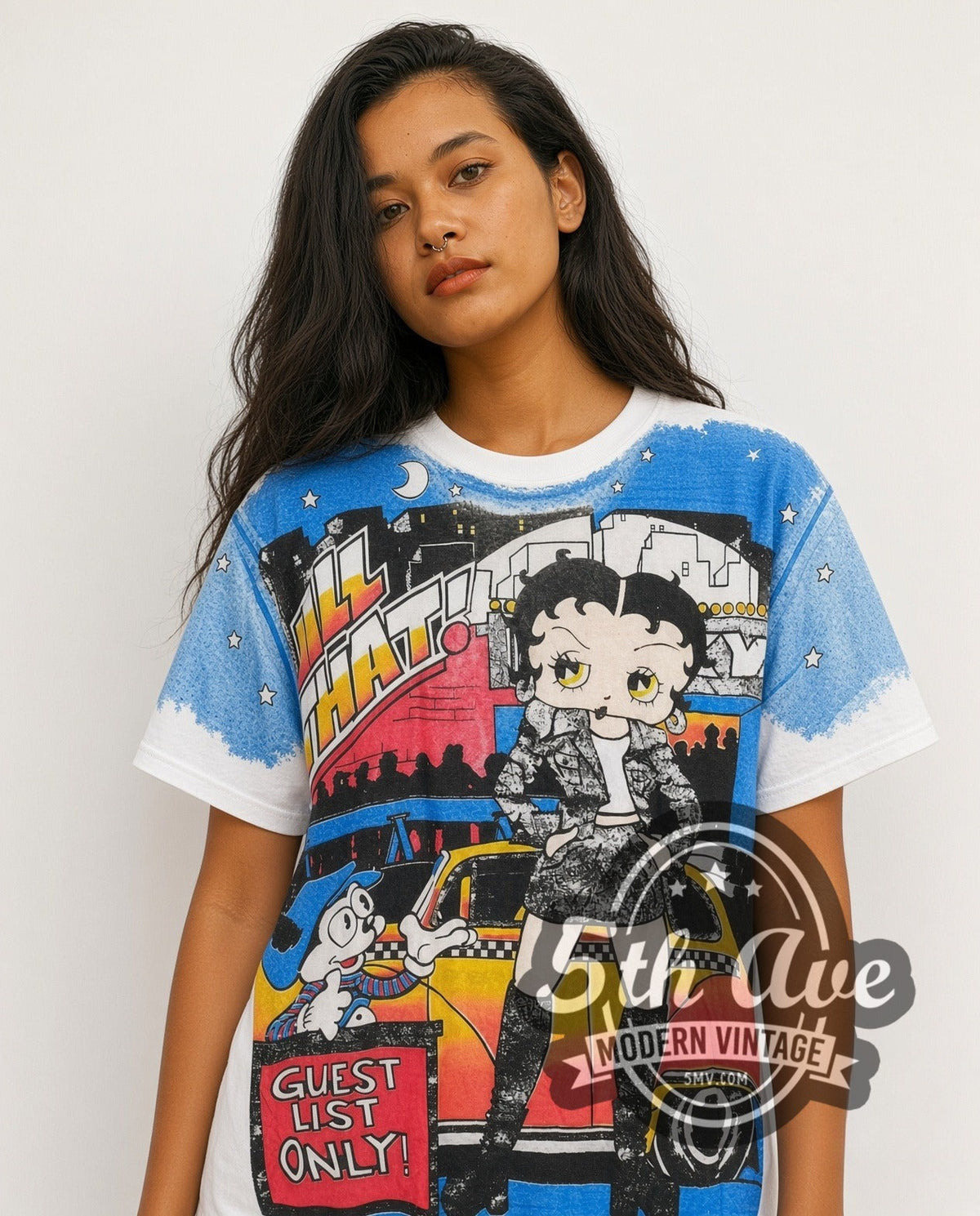 Model wearing the Betty Boop Guest List Only all-over-print vintage cartoon tee
