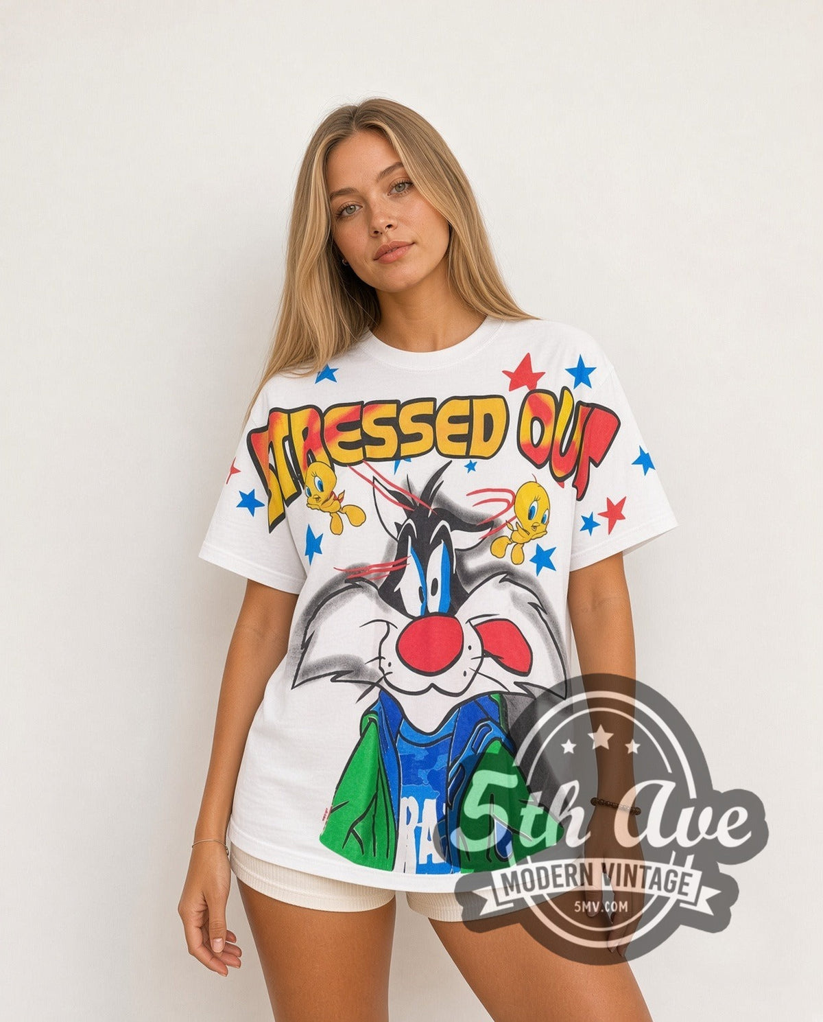 Model wearing the Looney Tunes Sylvester and Tweety Stressed Out all-over-print vintage cartoon tee