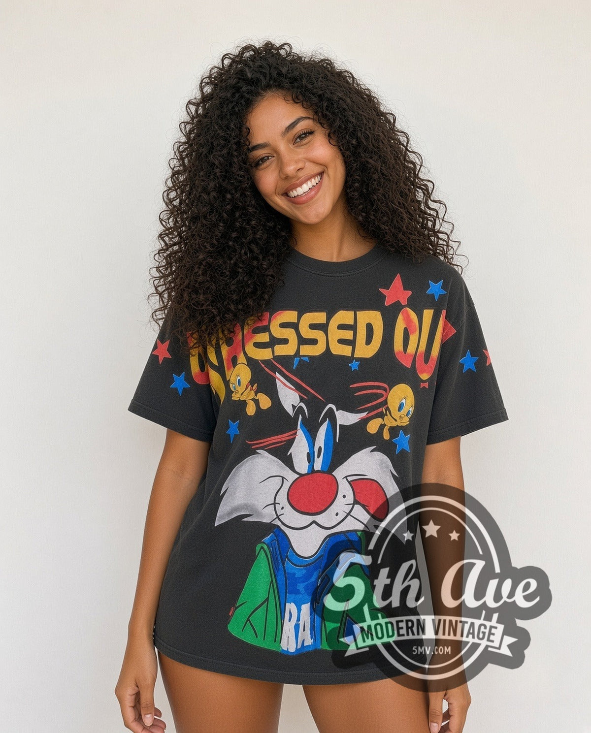 Model wearing the Looney Tunes Sylvester and Tweety all-over-print vintage cartoon tee