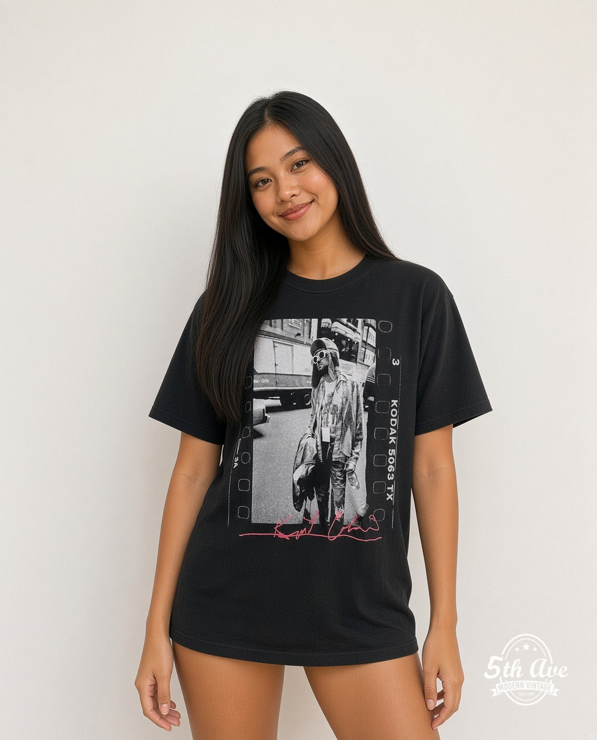 Model wearing the Nirvana Kurt Cobain Film Strip Pink Signature vintage band t-shirt