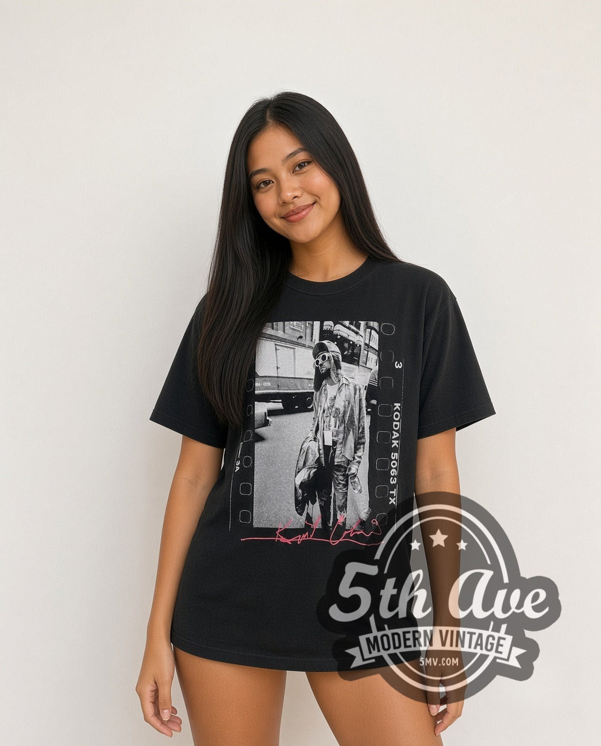 Model wearing the Nirvana Kurt Cobain Film Strip Pink Signature vintage band t-shirt