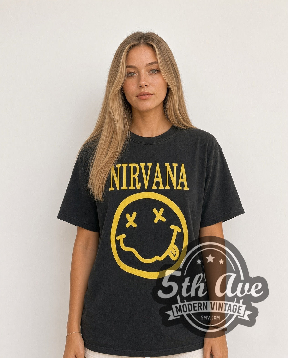 Model wearing the Nirvana Classic Yellow Smiley Face Logo vintage band t-shirt