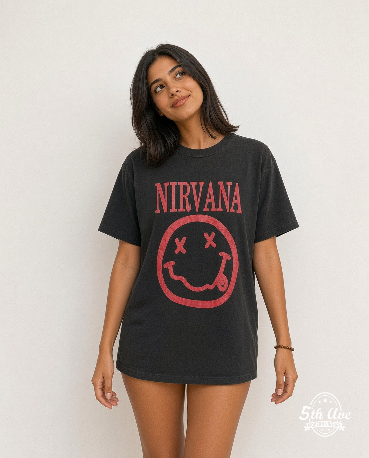 Model wearing the Nirvana Red Smiley Face Logo vintage band t-shirt