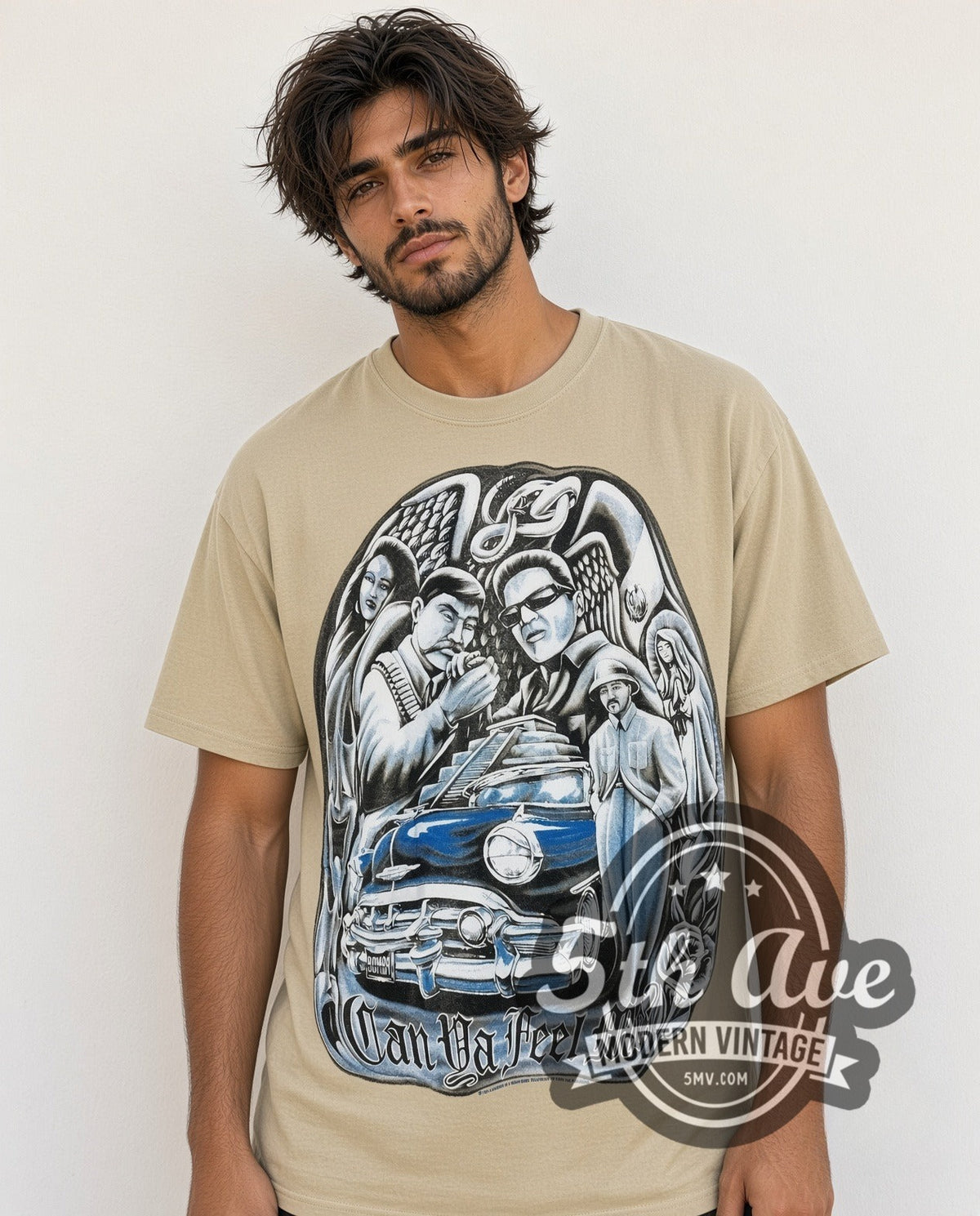 Model wearing the Rollin Hard Can Ya Feel Me Lowrider vintage graphic tee in sand