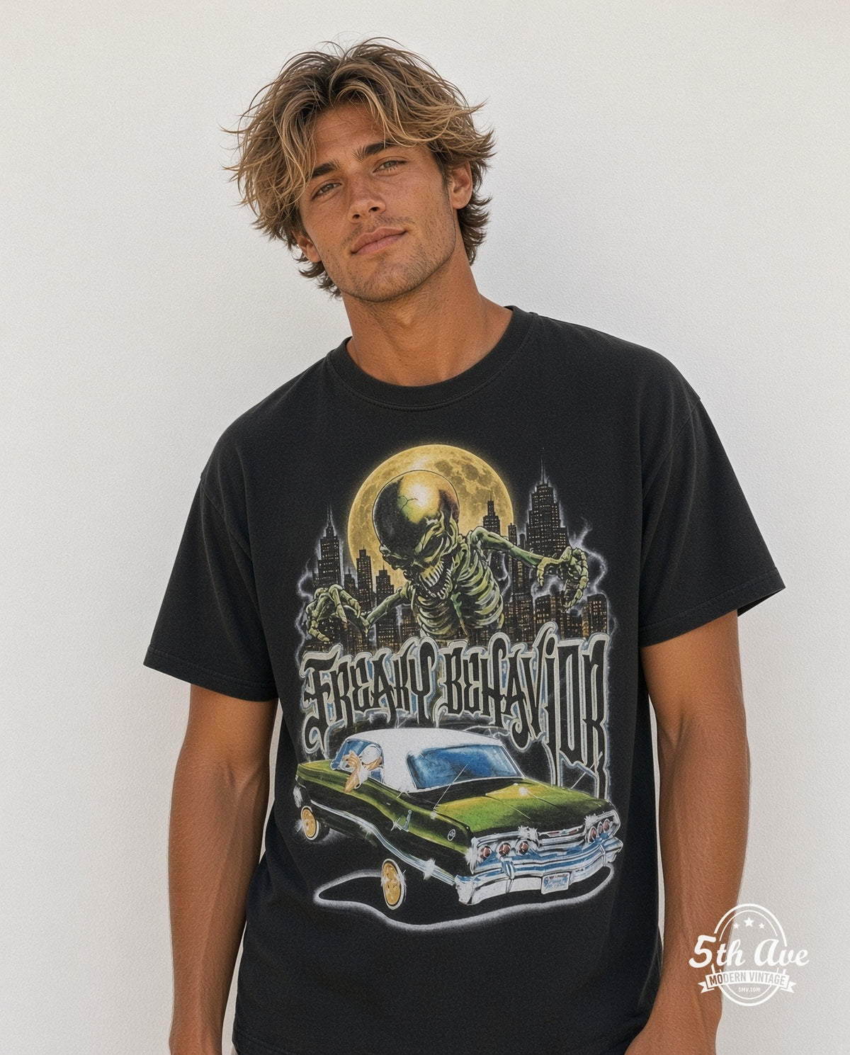 Model wearing the Rollin Hard Freaky Behavior Lowrider graphic tee