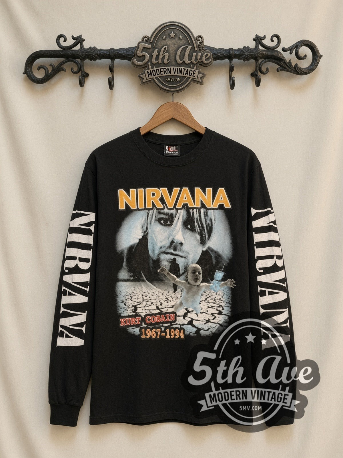 Nirvana Kurt Cobain 1967-1994 vintage band long sleeve t-shirt, front view on a display rack