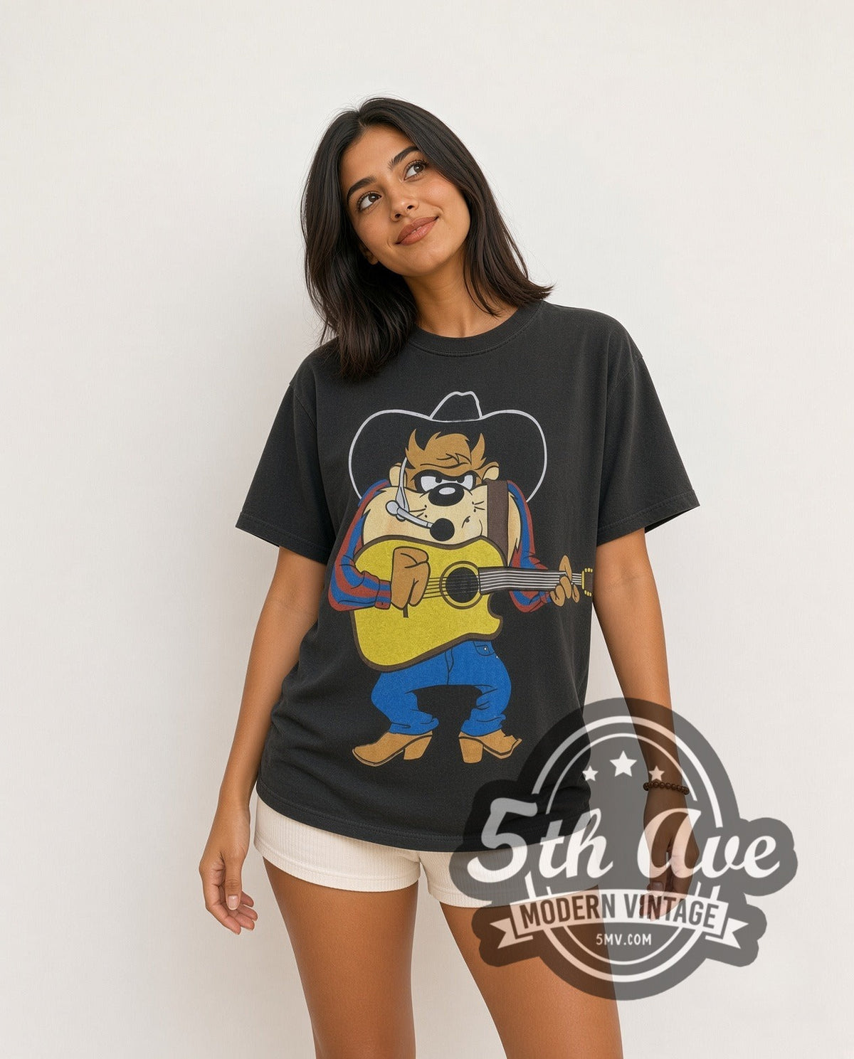 Model wearing the Looney Tunes Taz-Mania all-over-print vintage cartoon tee