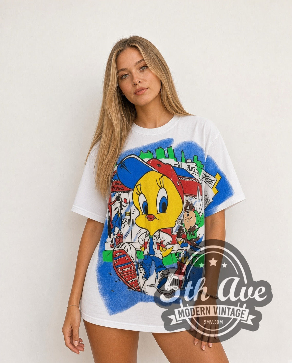 Model wearing the Looney Tunes Tweety, Taz and Sylvester all-over-print graphic tee