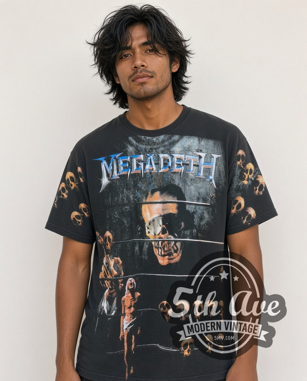 Model wearing the Megadeth Vic Rattlehead Multi Skull all-over-print vintage band t-shirt