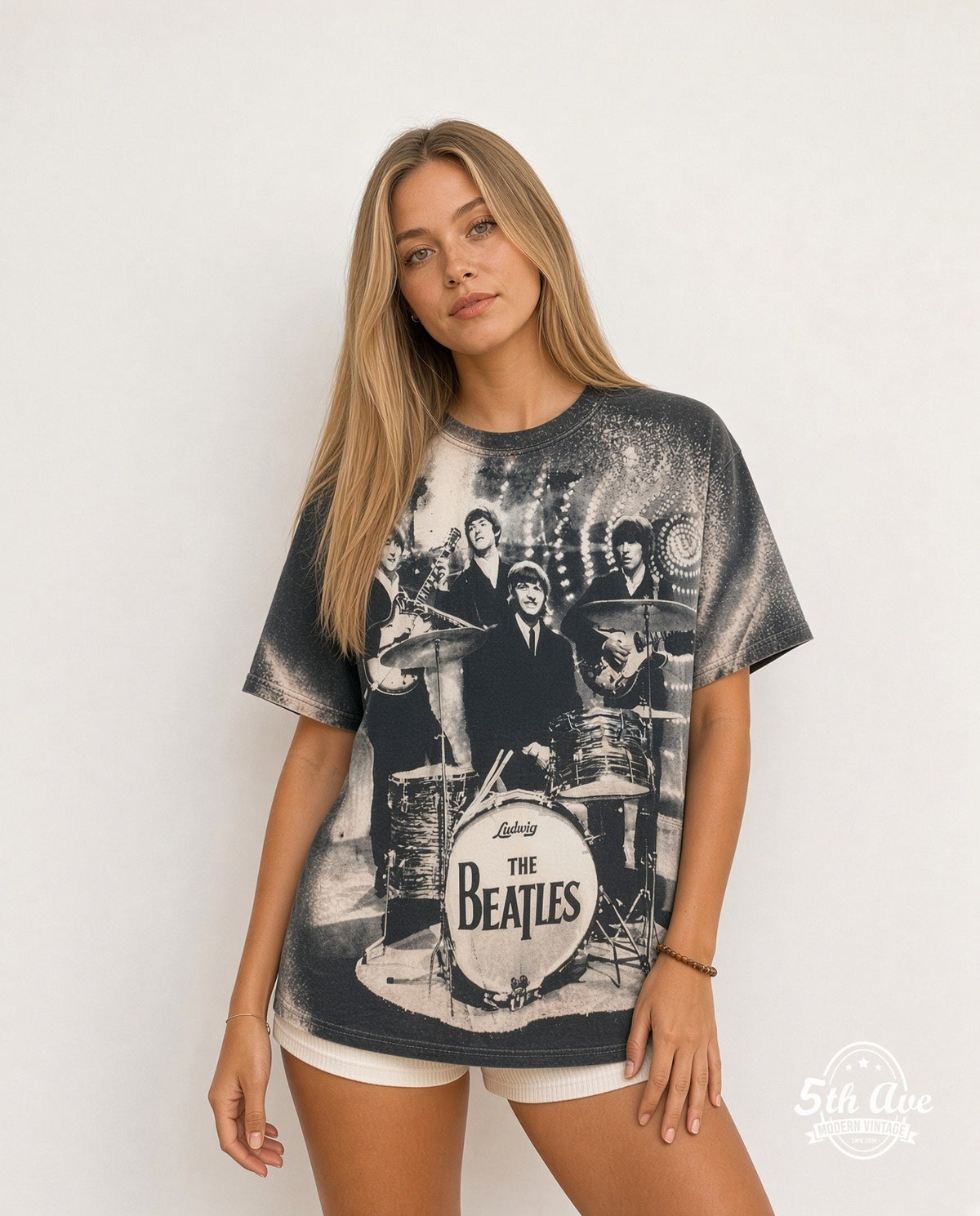 Model wearing The Beatles Live Stage Ludwig Drum all-over-print vintage band t-shirt in black