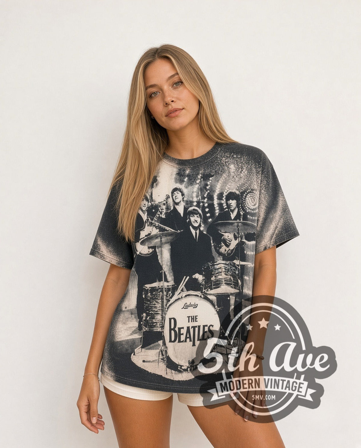 Model wearing The Beatles Live Stage Ludwig Drum all-over-print vintage band t-shirt in black