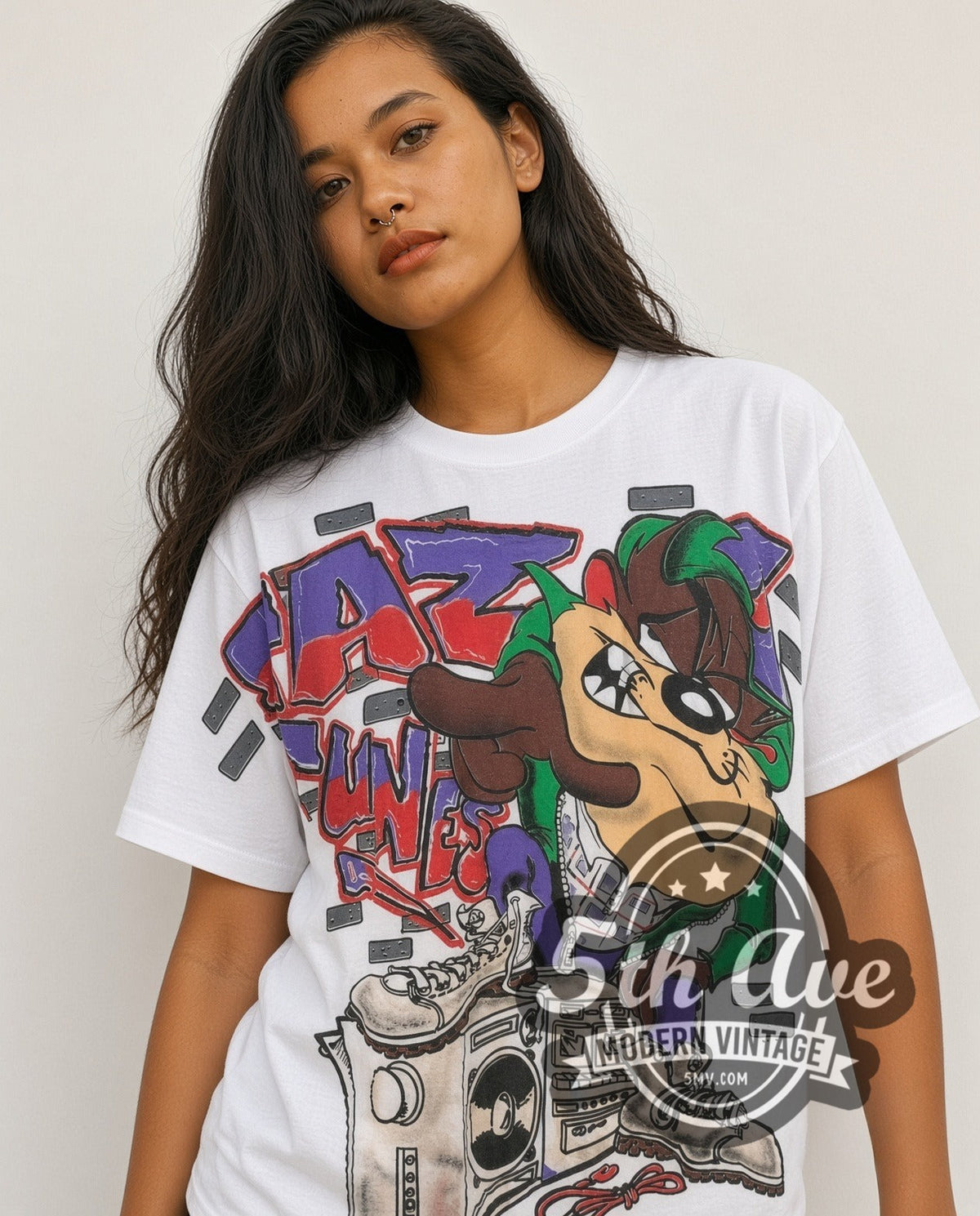 Model wearing the Looney Tunes Taz-Mania Classic Look all-over-print vintage cartoon tee