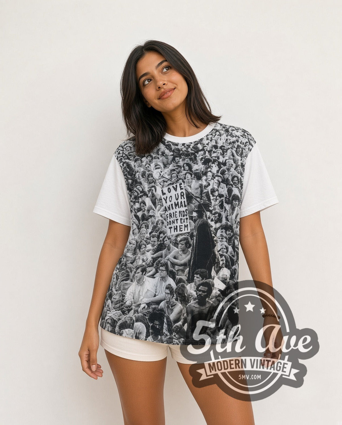 Model wearing the Woodstock Love Your Animal Friends, Don't Eat Them all-over-print vintage graphic tee