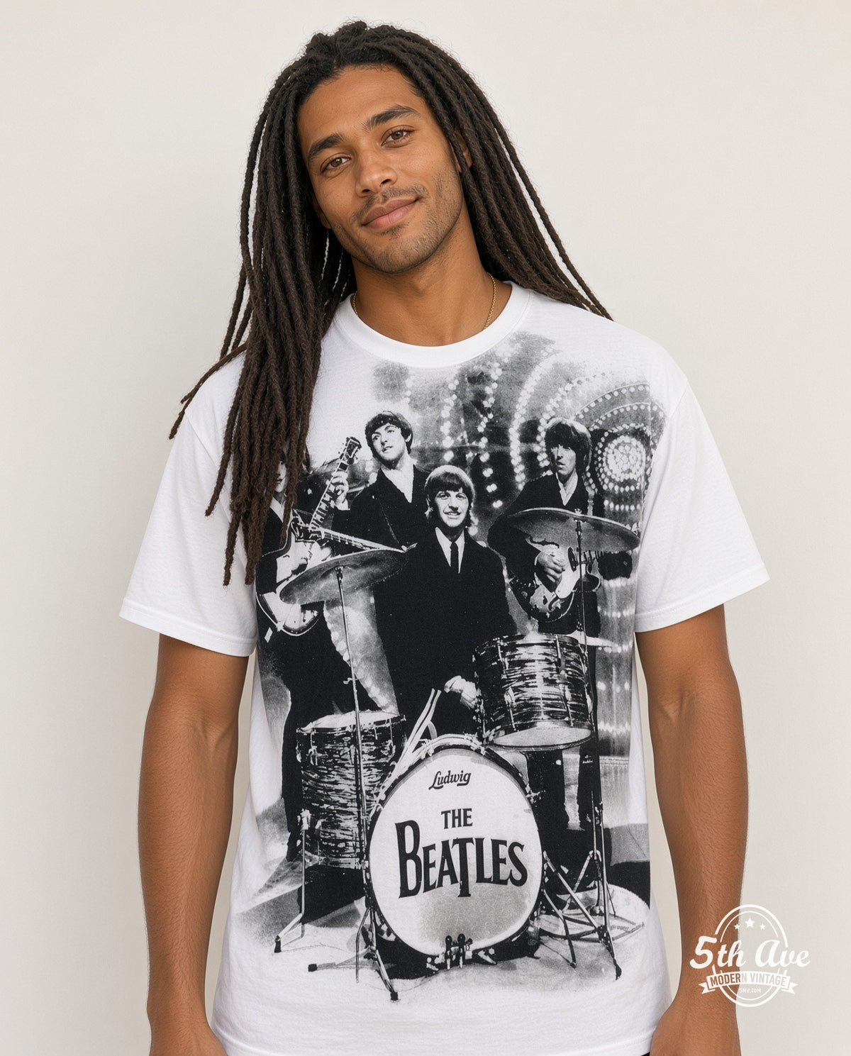 Model wearing The Beatles Live Stage Ludwig Drum all-over-print vintage band t-shirt in white
