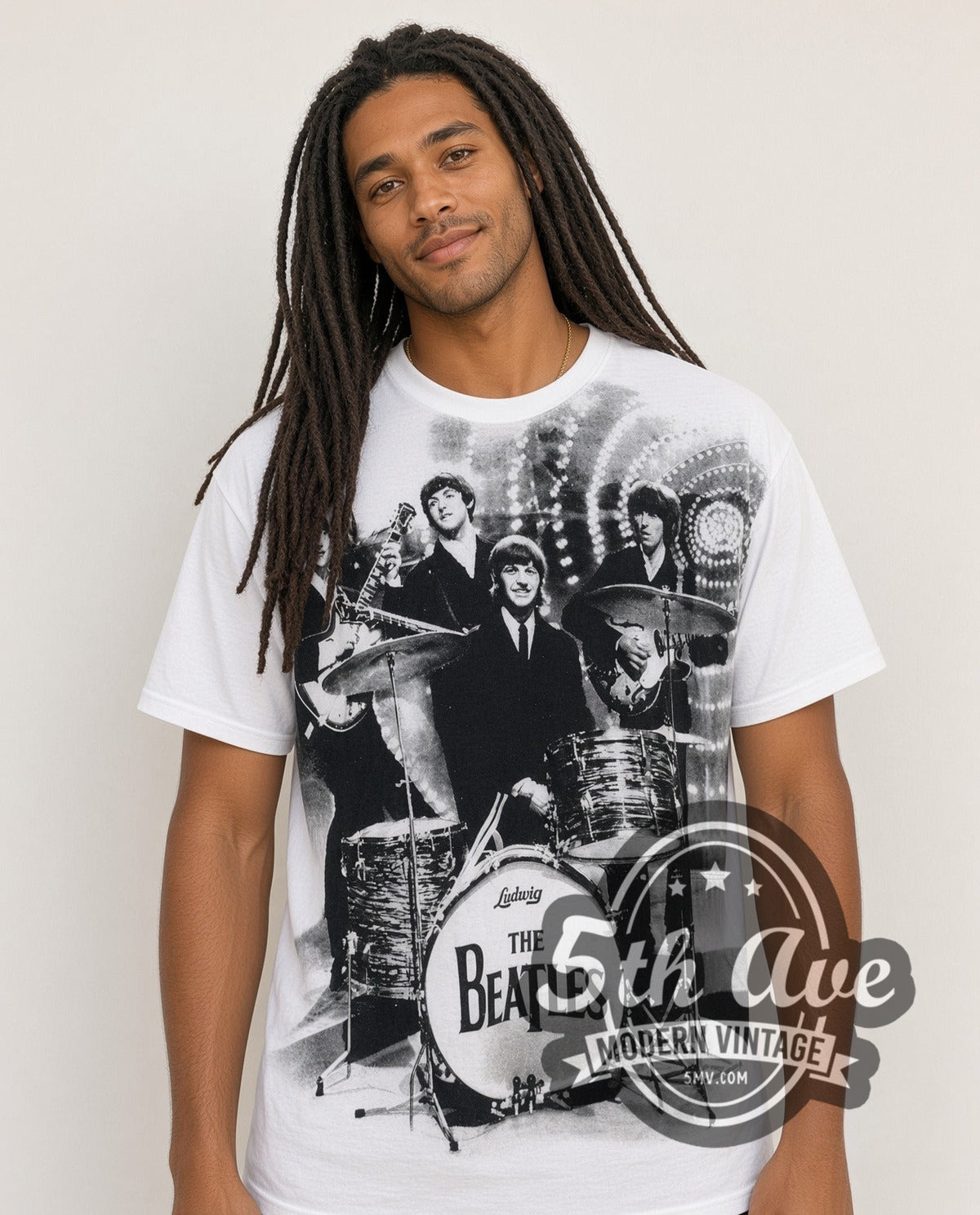 Model wearing The Beatles Live Stage Ludwig Drum all-over-print vintage band t-shirt in white