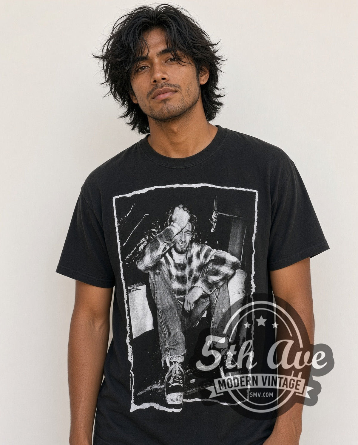 Model wearing the Nirvana Kurt Cobain all-over-print vintage band t-shirt