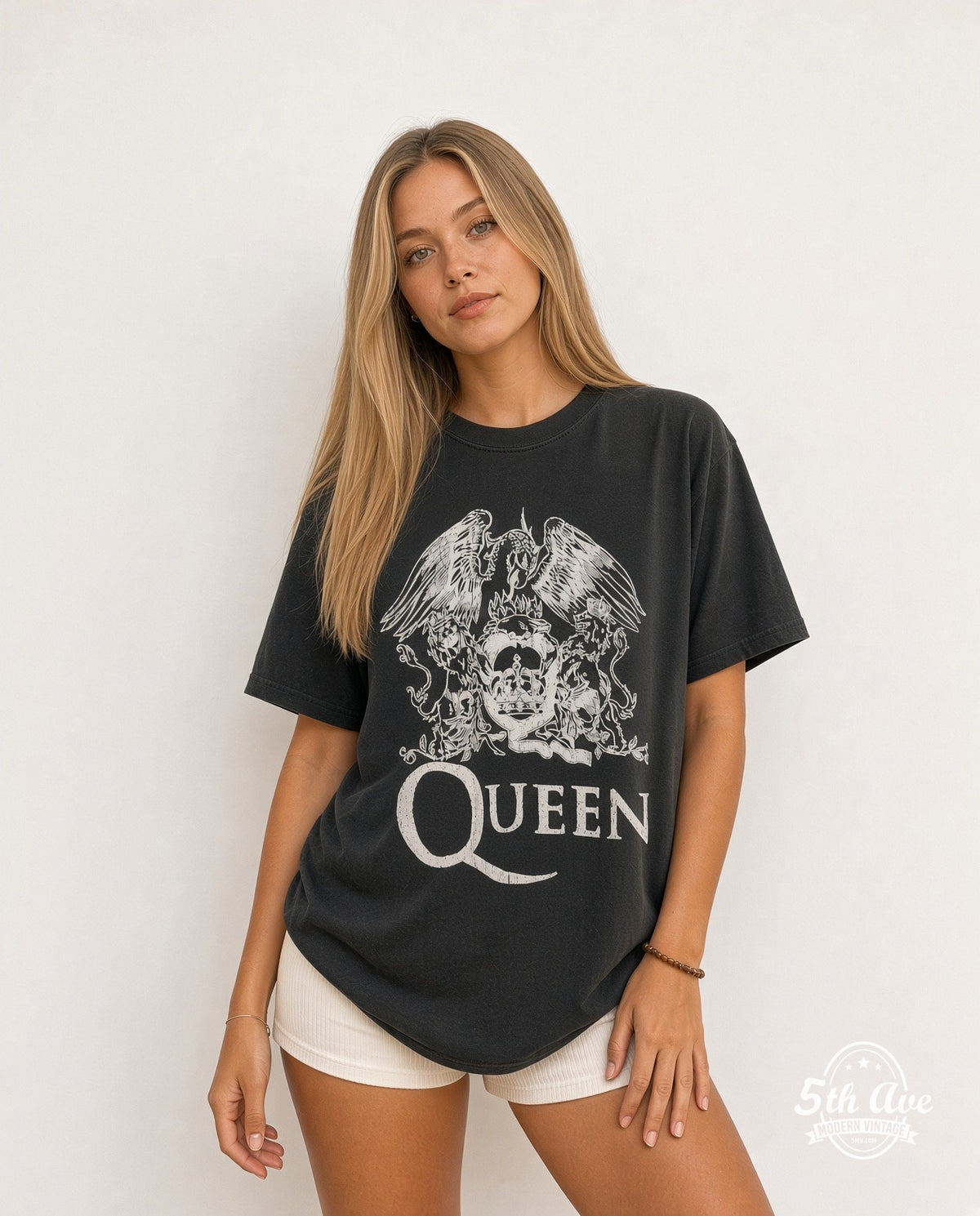 Model wearing the Queen Classic Crest White Print vintage band t-shirt in white