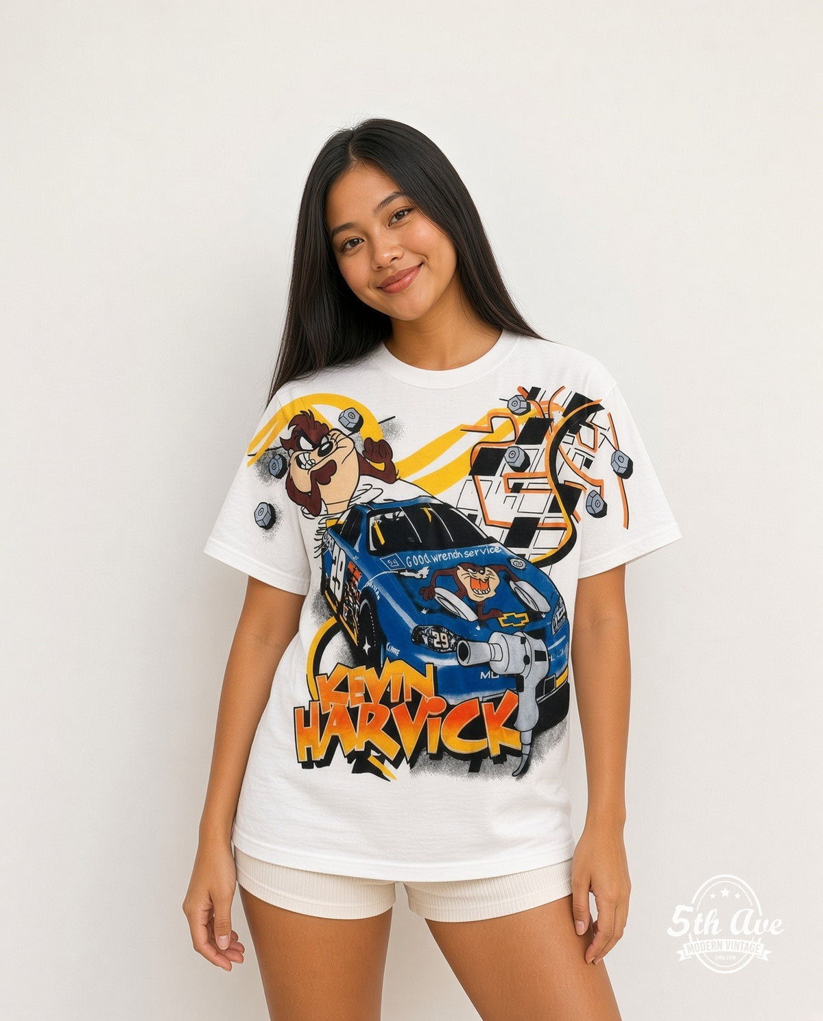 Model wearing the NASCAR Kevin Harvick #29 Taz Looney Tunes all-over-print NASCAR t-shirt in white