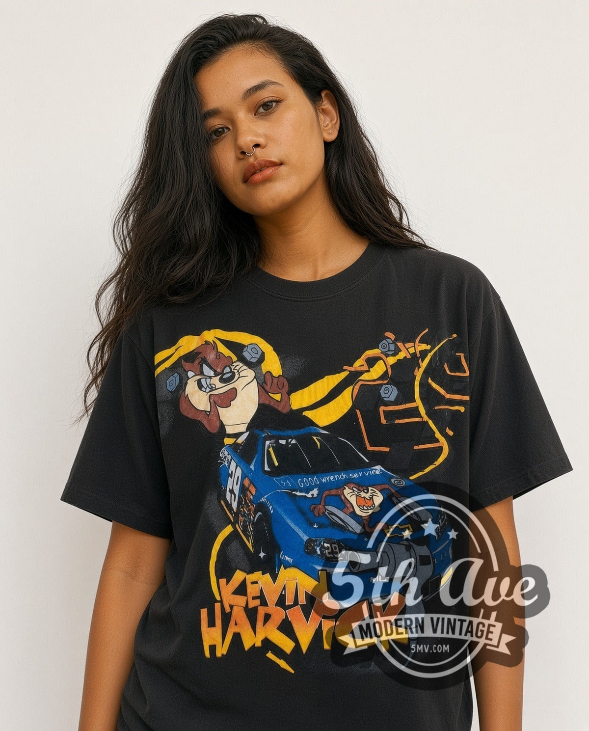 Model wearing the NASCAR Kevin Harvick #29 Taz Looney Tunes all-over-print vintage NASCAR t-shirt in black