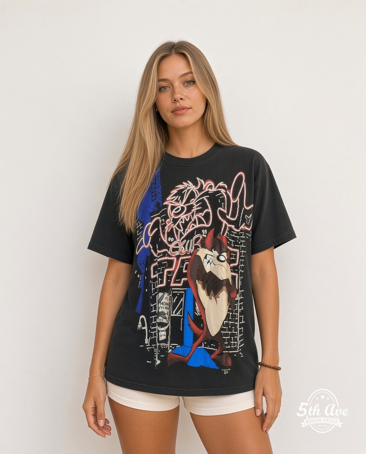 Model wearing the Looney Tunes Taz Mania Retro all-over-print graphic tee