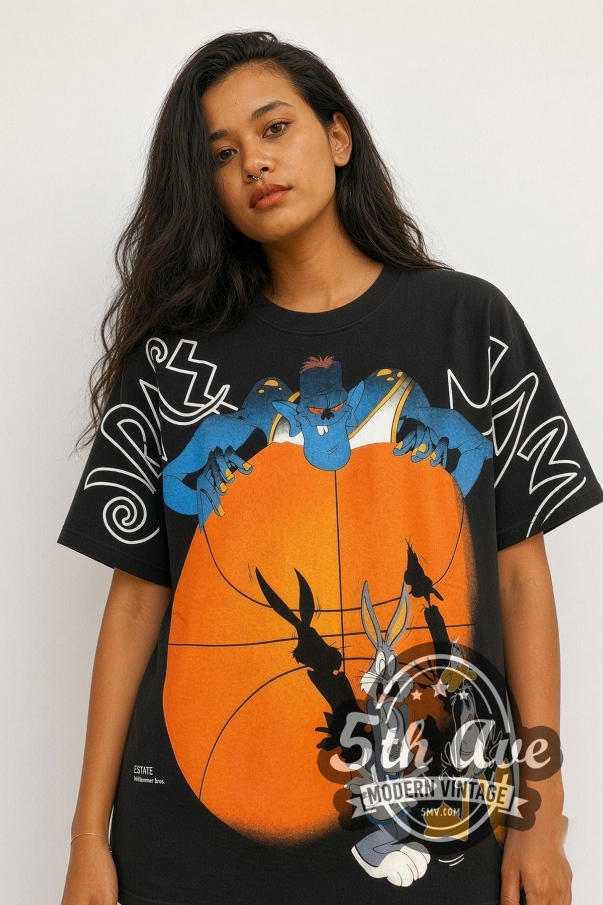 Model wearing the Looney Tunes Space Jam Bugs Bunny and Daffy Duck all-over-print vintage cartoon tee