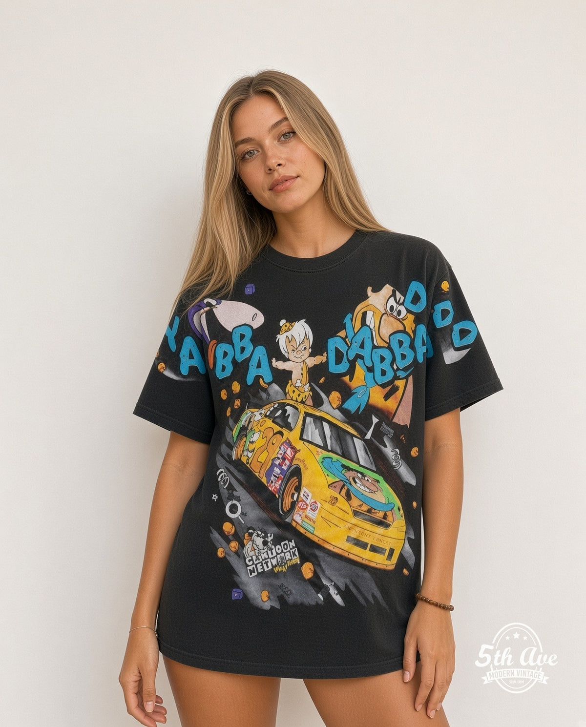 Model wearing the NASCAR Flintstones Yabba Dabba Doo Racing all-over-print NASCAR t-shirt in black
