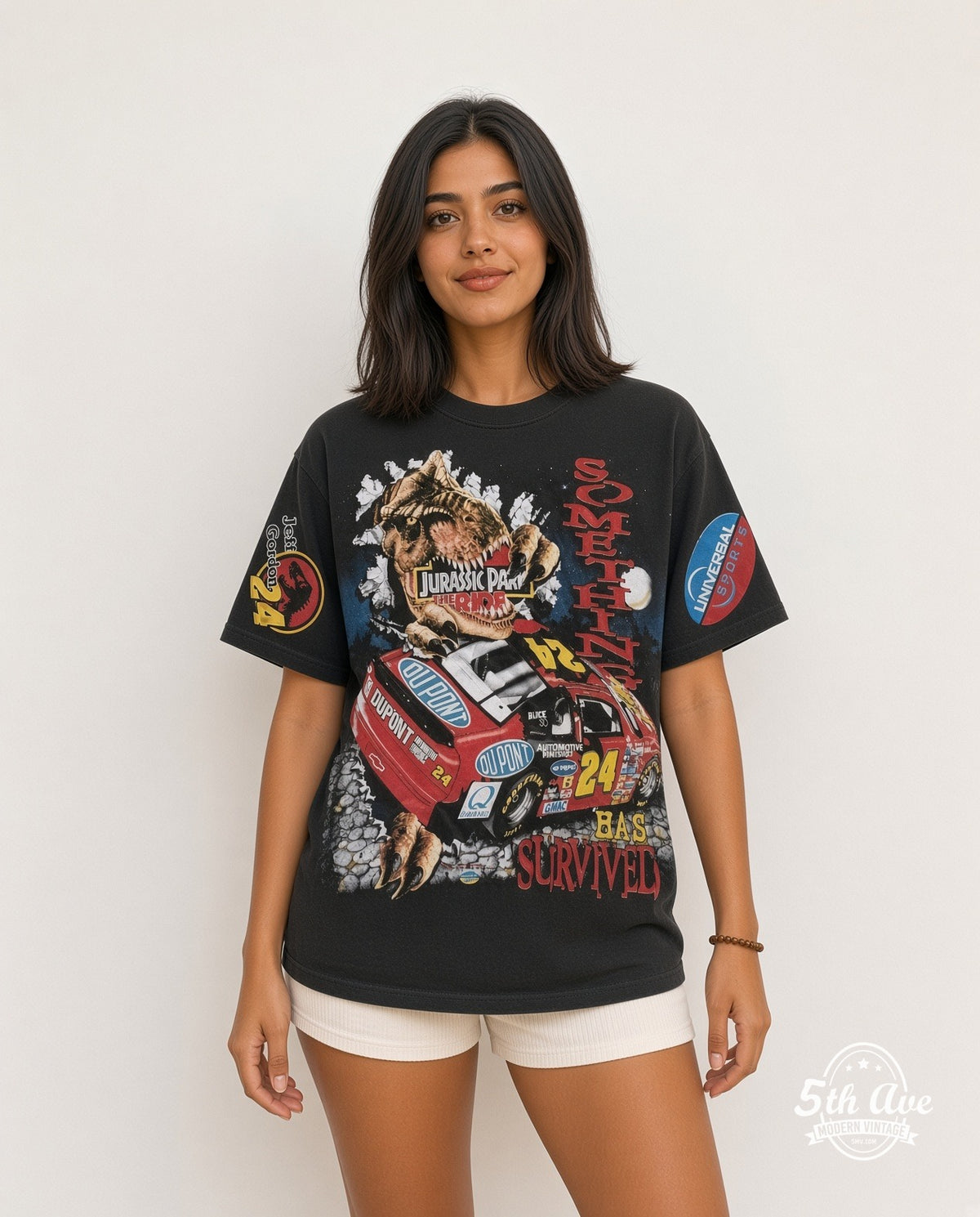 Model wearing the NASCAR Jeff Gordon #24 Jurassic Park The Ride all-over-print vintage graphic t-shirt in black
