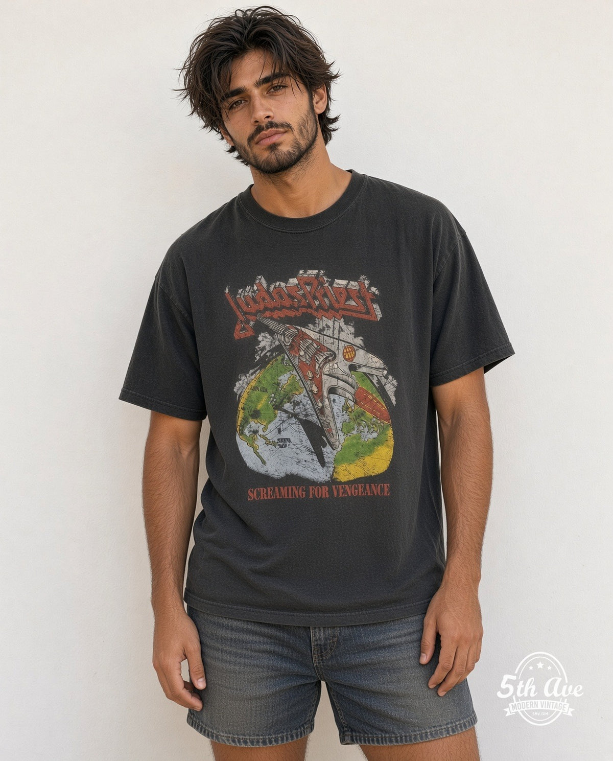 Model wearing the Judas Priest Point of Entry' Electric Guitar vintage band t-shirt