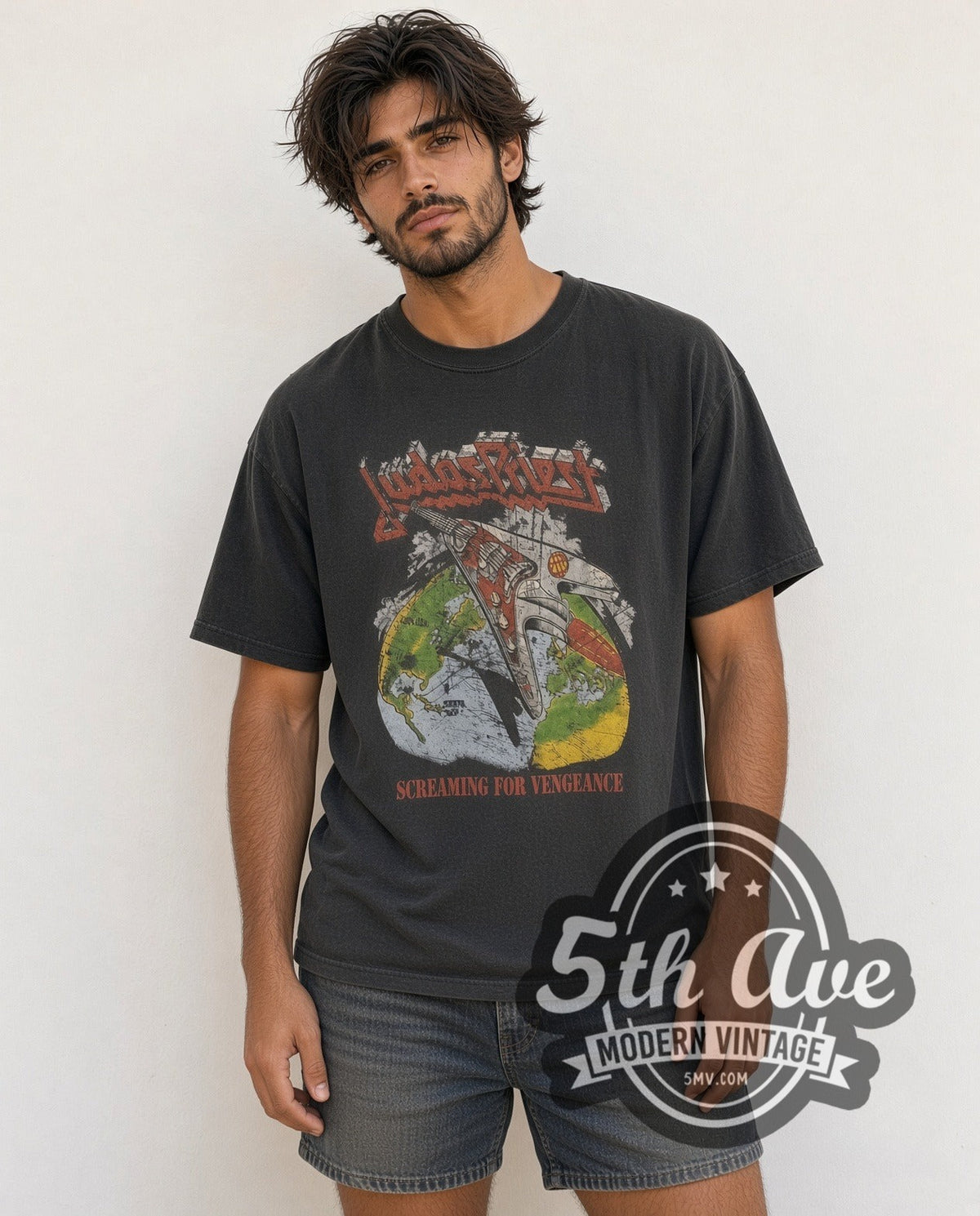 Model wearing the Judas Priest Point of Entry' Electric Guitar vintage band t-shirt