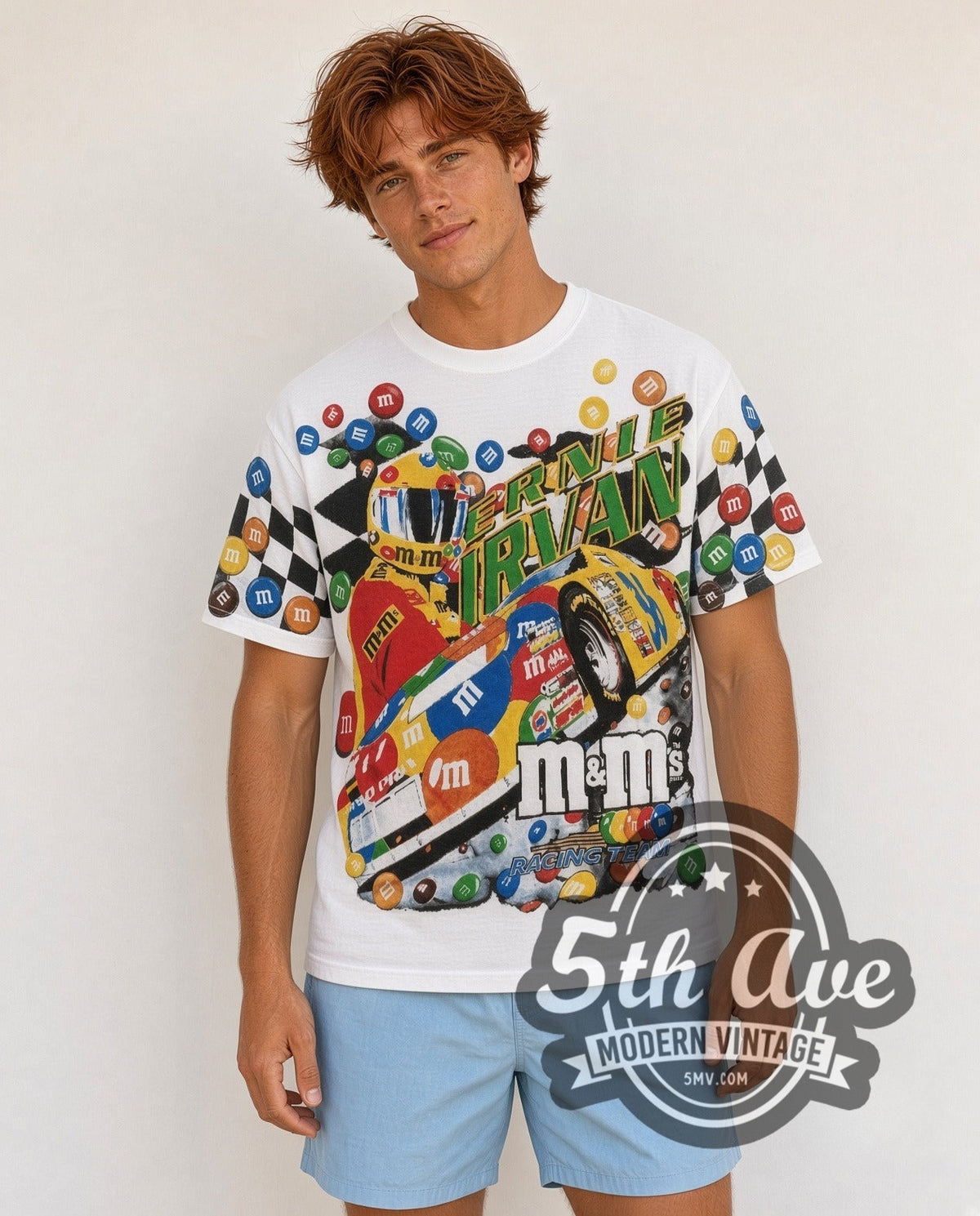 Model wearing the NASCAR Ernie Irvan #36 M&M's Angled Car all-over-print vintage NASCAR t-shirt in white