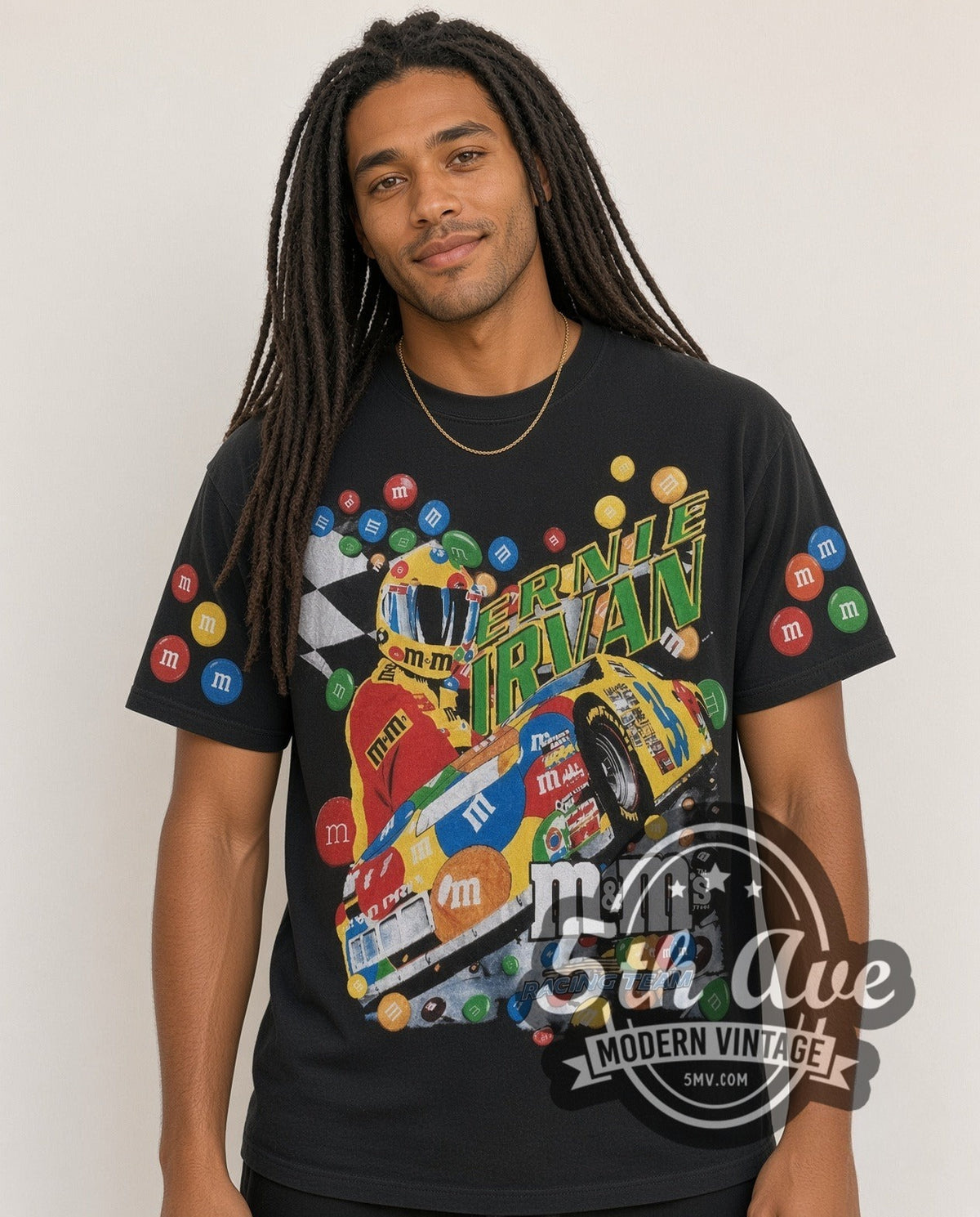 Model wearing the NASCAR Ernie Irvan #36 M&M's Angled Car all-over-print vintage NASCAR t-shirt in black