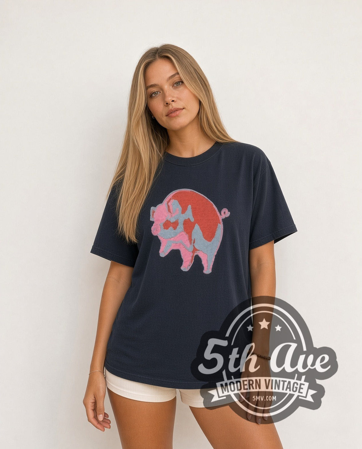 Model wearing the Pink Floyd Animals Red Pink Blue Pig vintage band t-shirt