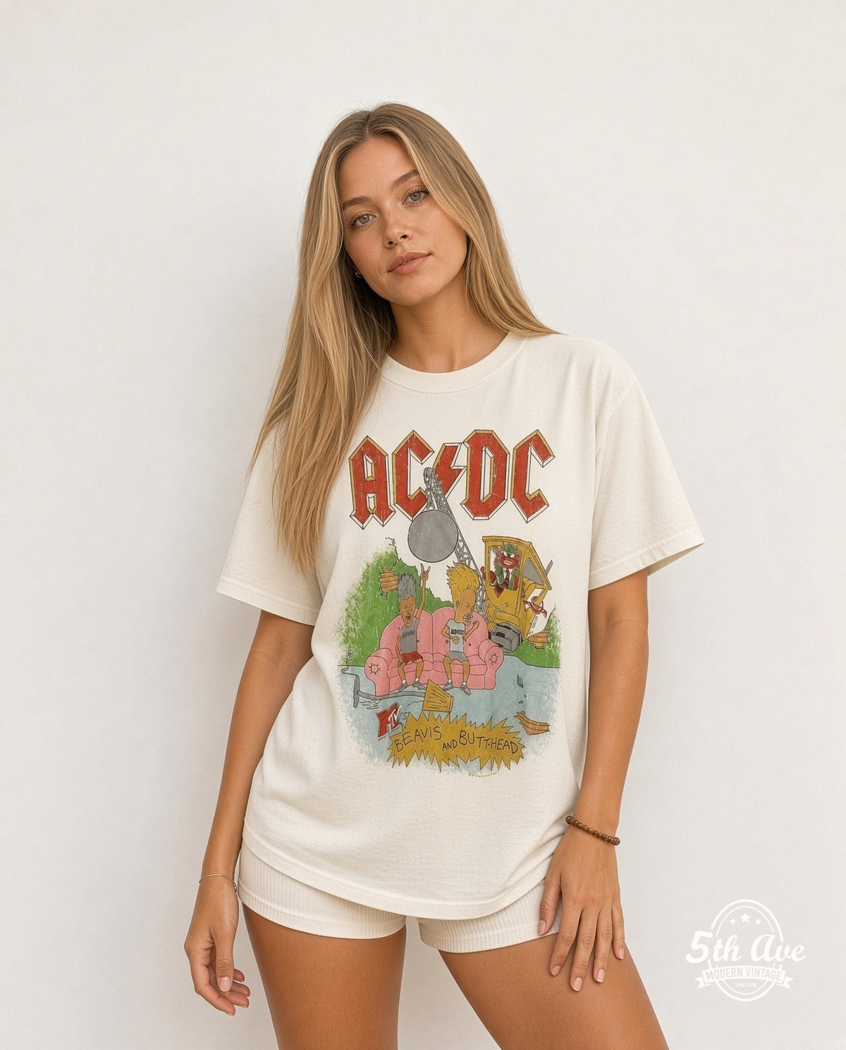 Model wearing the AC/DC x Beavis and Butt-Head Pink Couch White Tee Wrecking Ball vintage band t-shirt in white